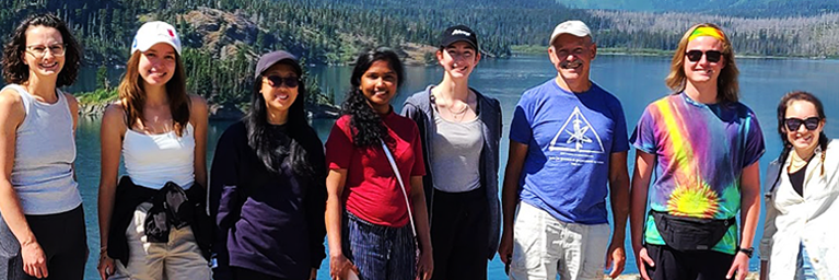 Professor Borries Demeler, centre-right, with members of his research team as they travel to a conference via Glacier Park, Montana, and take a break at a scenic spot. © Borries Demeler